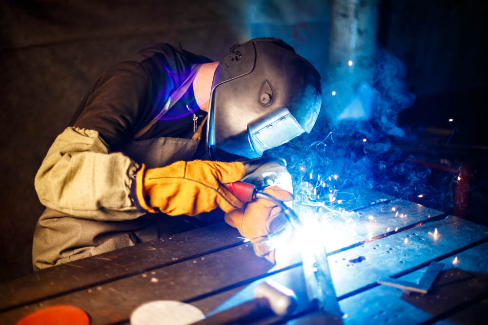 A MIG welder from Huxley Design showing precision and power during welding tasks.