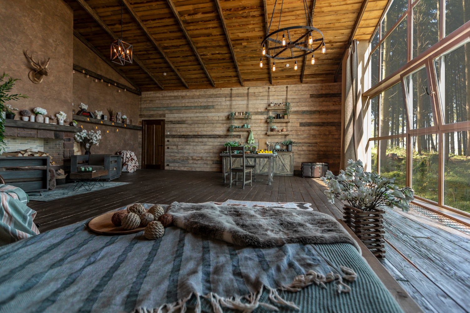 A cozy barndominium interior featuring rustic wood accents, large windows, and an open, inviting living area